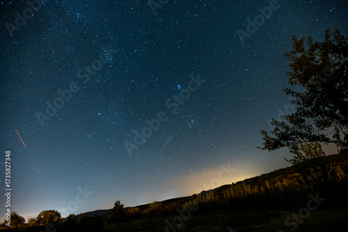 Long exposure of stars on a mountain top