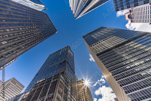 Street level view of highrise buildings at 6th Ave & W 53rd St, Manhattan cityscape. New York, USA