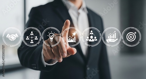 Businessman Touching Virtual Screen with Business Strategy and HR Management Icons