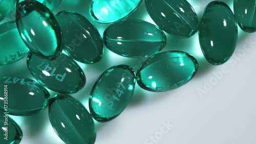 Pile of blue color soft gel capsule isolated on white background.