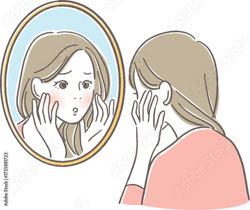 鏡を見つめる女性