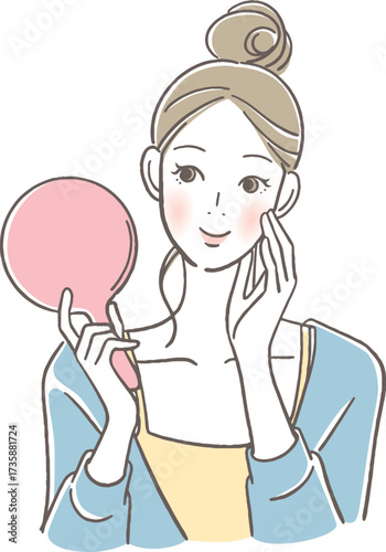 手鏡を見る女性