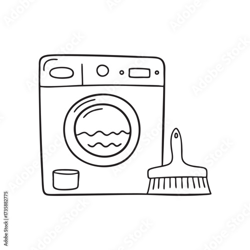 A washing machine next to a dustpan and brush set