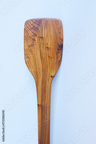 Wooden kitchen utensils stacked view close up isolated