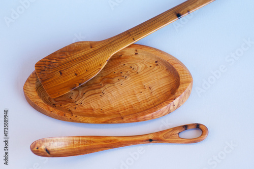 Wooden kitchen utensils stacked view close up isolated