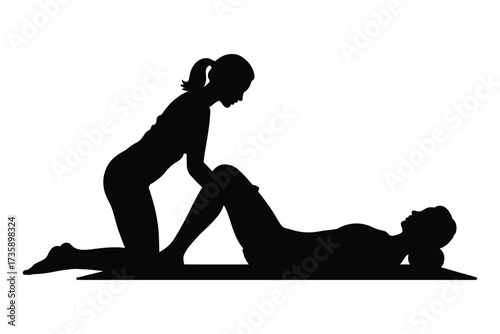 Silhouettes of two women practicing yoga on a mat