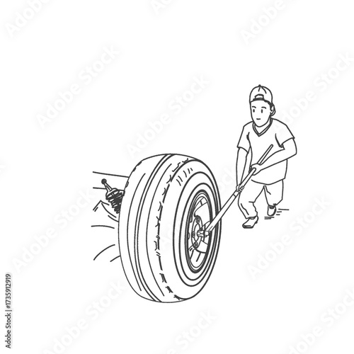 a mechanic man removing the bolts on a truck wheel for repairs