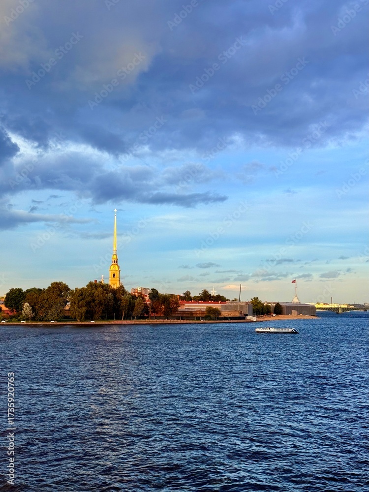 Naklejka premium beautiful cathedral with high spire on the island of the city