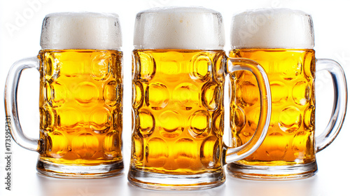 three large beer mugs with golden frothy beer