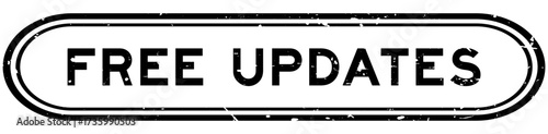 Grunge black free updates word rubber seal stamp on white background