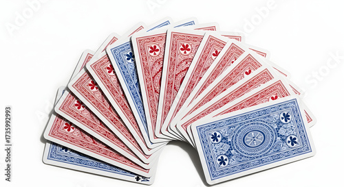A fanned out deck of playing cards with red and blue backs, arranged on a white surface, ready for a game