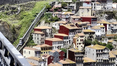 Porto, Portugal, traditional old city buildings with orange tiled roofs nestled into the steep