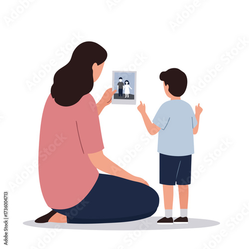 Mother and son looking at family photo.