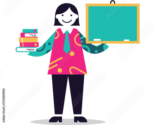 Smiling female teacher holding books standing next to a chalkboard ready for a lesson in a classroom