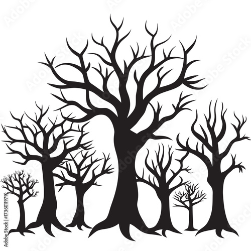 Silhouette of bare trees in a spooky forest