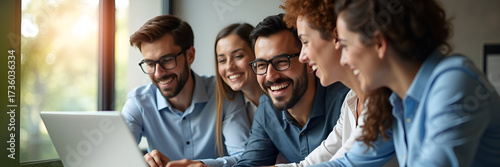A happy and diverse team of professional managers collaborating on a laptop during a virtual meeting, embodying teamwork and productivity under natural lighting. Ample copy space.