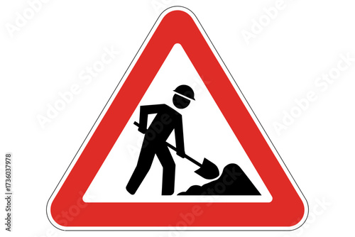 Warning sign alerts to road construction and manual labor ahead