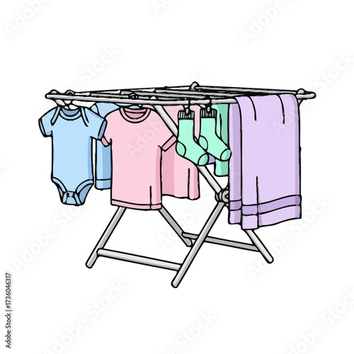 Baby clothes and socks drying on rack