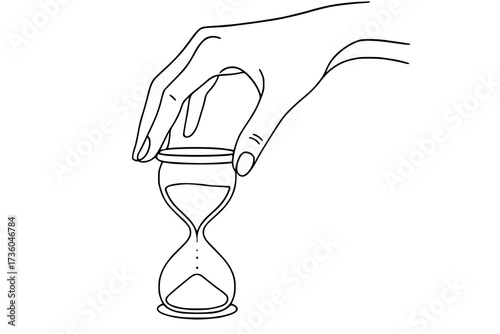 hand flipping hourglass upside down