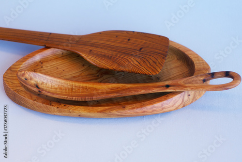 Wooden kitchen utensils stacked view close up isolated