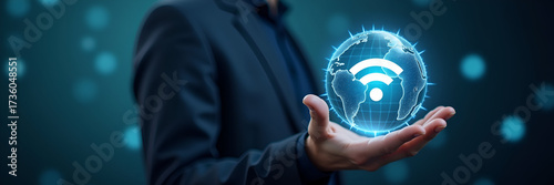 An individual illustrates the concept of WiFi 7 connectivity, presenting a holographic globe adorned with the WiFi 7 symbol. The imagery allows for ample copy space, emphasizing advancements in wirele
