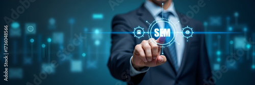 Businessman points to SEM icons on digital interface representing search engine marketing SEO strategies and online advertising rankings. concept as Businessman points to SEM icons on digital interfac