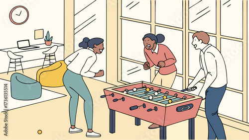 Three colleagues are playing table football in the office, laughing and cheering, enjoying a break from work and having fun together