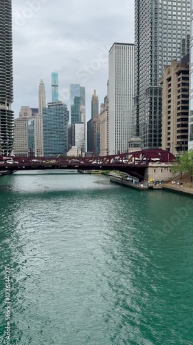 Daytime views of the Chicago River and Chicago, Illinois Skyline. Summer scene looking across the river to the Clark Street Bridge and beautiful urban architecture. 
