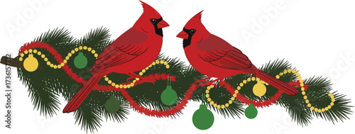 Two red cardinals perched on a decorated christmas branch
