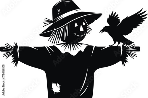 Black silhouette of a scarecrow with a crow on its arm