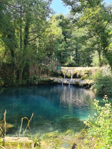 Waterfall Capelli di Venere, small mountainside cascade surrounded by vegetation, close to a ruined mill, Casaletto Spartano, Province of Salerno, Italy