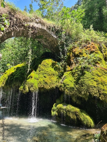 Waterfall Capelli di Venere, small mountainside cascade surrounded by vegetation, close to a ruined mill, Casaletto Spartano, Province of Salerno, Italy