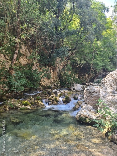 Waterfall Capelli di Venere, small mountainside cascade surrounded by vegetation, close to a ruined mill, Casaletto Spartano, Province of Salerno, Italy