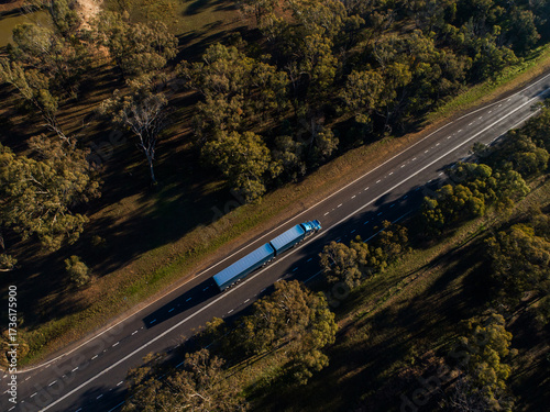 Semi-trailer truck travelling down Newell Highway road in Dubbo seen from aerial view
