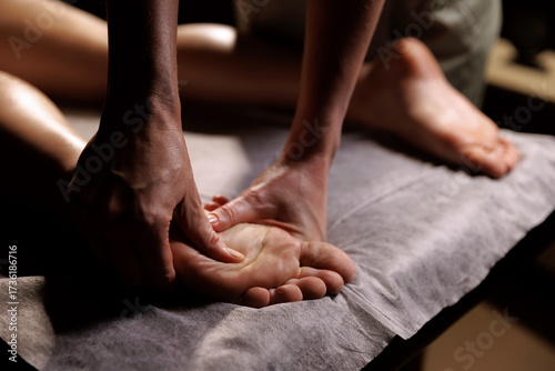 Luxury foot massage in spa salon. Professional therapist performing relaxing wellness treatment for recovery and balance.