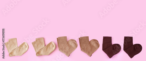 Flat Lay of Ribbed Cotton Socks in Coffee Tones on Pink Background