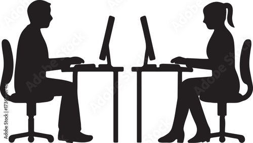 Two silhouetted figures working on computers at desks in an office setting