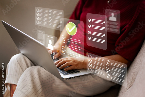 Bild auf Leinwand Person hands using laptop keyboard completing digital forms online checklists ta
