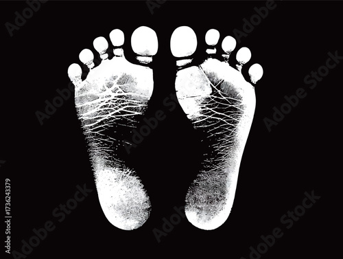 Two human footprints are centered on a dark background, showcasing the unique lines and curves of the foot anatomy. The contrast highlights the texture clearly.