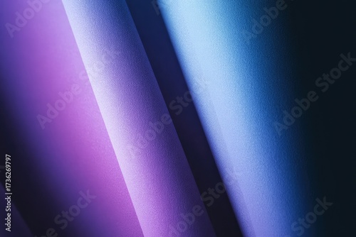 Abstract gradient of purple to blue with soft, curved, textured shapes