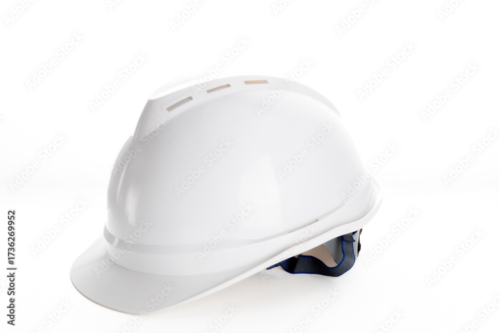 Fototapeta premium White hard hat on a white background, symbol of construction safety 