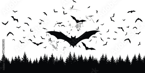 Bats flying in the night sky with a full moon and silhouetted trees below them