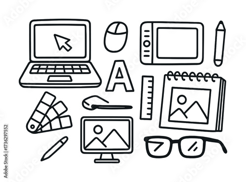 Digital design tools collection with laptop, graphics tablet, and accessories