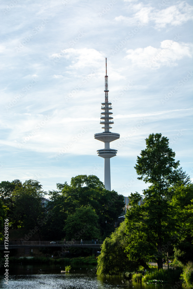 Fototapeta premium Communication tower by serene lake