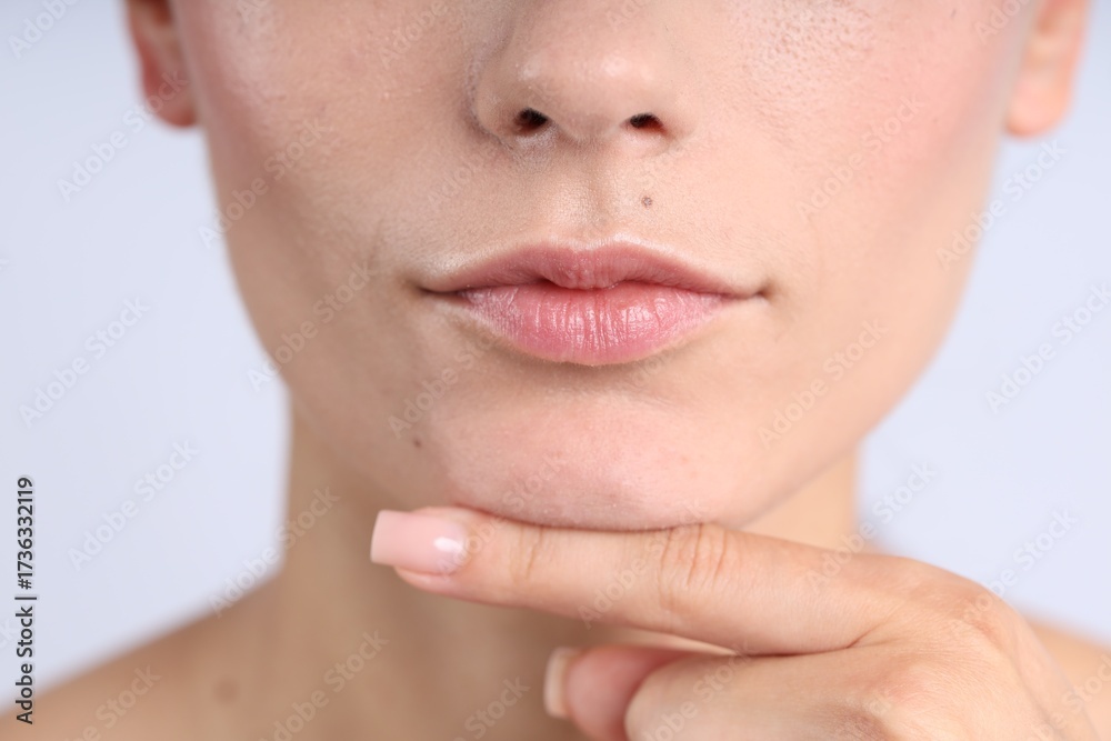 Obraz premium Woman with normal skin on light background, closeup