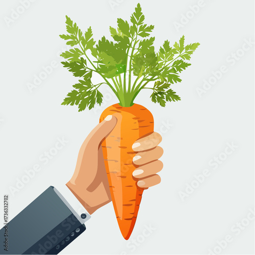 Businessman's hand holding a large fresh carrot as a symbol of motivation, incentive, and successful reward in a business concept