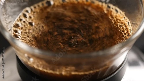 Mesmerizing Macro Liquid Spreading Over Vivid Blue Pigment Powder, Blending with Red and Yellow for Dynamic Abstract Color Fusion