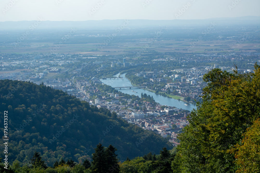 Fototapeta premium Aerial view of river and city in a valley