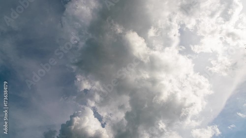 Timelapse backdrop of clouds developing against blue sky