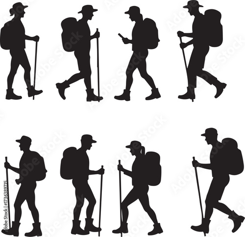 Silhouettes of hikers with backpacks and walking sticks